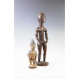 A ivory coast Bauli male ancestor carving, modelled nude, standing on a circular plinth base, 48cm