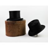 Two vintage silk top hats, to include 'Dunn Co' of London and a second London made example, along
