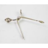 A pair of Danish silver acorn pattern sugar tongs, Georg Jensen, import marks for London 1931,