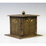 An early 20th century brass Art Nouveau tea caddy, of square planished form with stylized sprig
