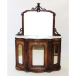 A Victorian walnut mirror back chiffonier,the arched mirror with a carved leafy crest above the