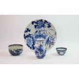 A 19th century Japanese porcelain blue and white plate, decorated with central floral spray and a