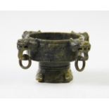 A Chinese Nephrite spinach jade censer, of circular form with four lions mask ring handles, carved