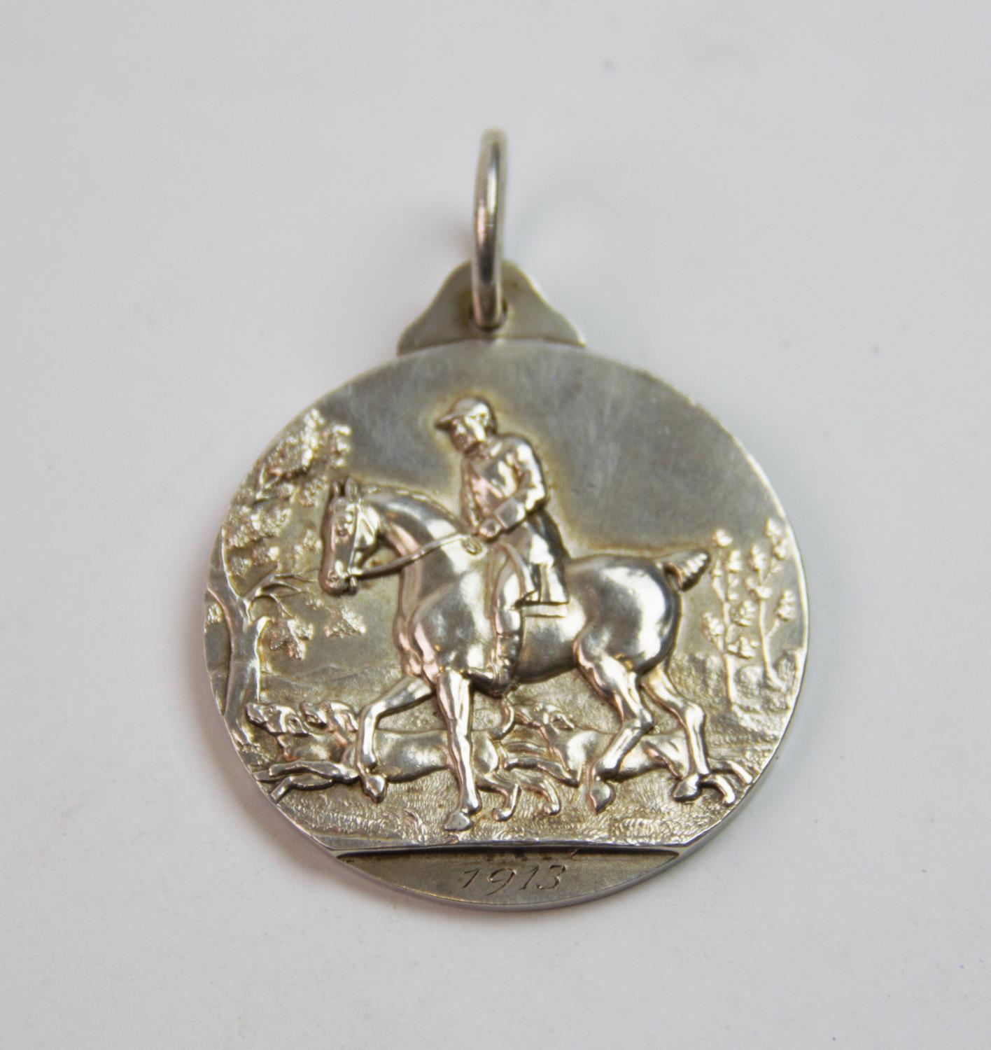 A George V silver medal, Frank Hyams Ltd, Birmingham 1912, inscribed 'Hunters Improvement &