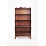 A modern yew wood waterfall bookcase, 150cm H x 77cm W x 38cm D