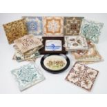 A collection of seventeen 19th century and later ceramic tiles, decorated with various floral and