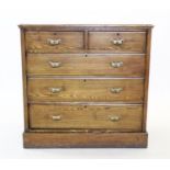 A Victorian ash chest of drawers, with a rectangular moulded top above two short and three long