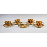 Four Royal Worcester tea cups and saucers, mid 20th century, decorated with hand painted fruit