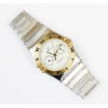 An Omega Constellation stainless steel wristwatch, the circular white dial with dot markers and