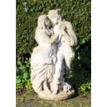 A reconstituted stone garden ornament, modelled as a courting couple upon a circular base, 73cm high