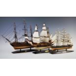 Three resin model tall ships, comprising: HMS Victory, in full rigging without sails, 38cm high x