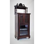 An Edwardian walnut music cabinet,with a swans neck pediment above a single shelf and rectangular