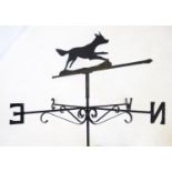 A wrought iron running fox weather vane, the rotating running fox pointer above the N,E,S,W