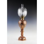 A John Pearson (Newlyn) Arts and Crafts copper and brass oil lamp, late 19th century, the base of