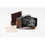 A Zeiss Ikon Super Ikonta folding camera No 58112, fitted with f3.5 Tessar lens No 85275, with