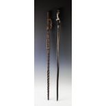 An African colonial period staff, with carved figure and a section with reticulated spikes, 95cm
