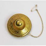 A Victorian circular Etruscan target brooch, the unmarked yellow metal brooch with applied
