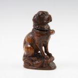 A Black Forest carved woooden vesta or match holder, modelled as a St Bernard dog with hinged head