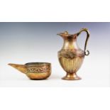 An embossed Persian copper water ewer of baluster form with hinged lid and scroll handle, 33cm high,