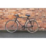 A 1930's gents Raleigh bicycle, fitted with down swept handlebars, three speed gears and full length