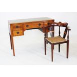 An Edwardian mahogany and cross banded writing desk, with a green leather and gilt tooled writing