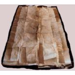 An animal skin rug, the rectangular rug created from various animal pelts, 222cm x 144cm