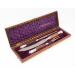 A silver mounted carving set, 'H H', Sheffield 1931, comprising: a carving knife, meat skewer and