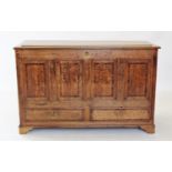 A George III oak and cross banded mule chest, with four mahogany cross banded panels above a pair of