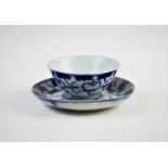 An associated tea bowl and saucer, 17th century, decorated in underglazed blue tones, marked to
