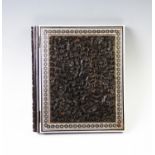 A late 19th century Anglo-Indian vizagapatam folio, hinged wood of ebonised colouring, carved