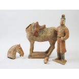 A Chinese pottery Tang dynasty style horse and warrior, 28cm high and 29.5cm (2) (at fault)