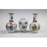 A pair of 19th Century Chinese canton famille rose vases, each bottle shaped vase with flared necks,