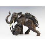 A large Japanese bronze model of tigers attacking an elephant, Meiji period, realistically