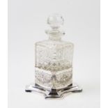An early 20th century cut glass decanter, with globular stopper, with an Edwardian quatreform silver