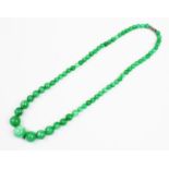 A jade coloured beaded necklace, the single row necklace comprising graduating round polished