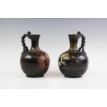 Two Apulian ceramic blackware lekythos, possibly 5th-3rd century BC. each with flared neck and