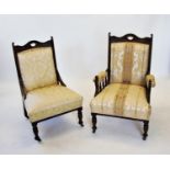 A pair of Edwardian walnut ladies and gentleman's drawing room chairs, each chair with a carved