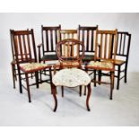 A set of six Arts and Crafts stained beech dining chairs, each with a lath back and legs of tapering