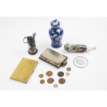 A collection of tribal items to include, a 19th century Chinese Kangxi vase with foo dog lid, a