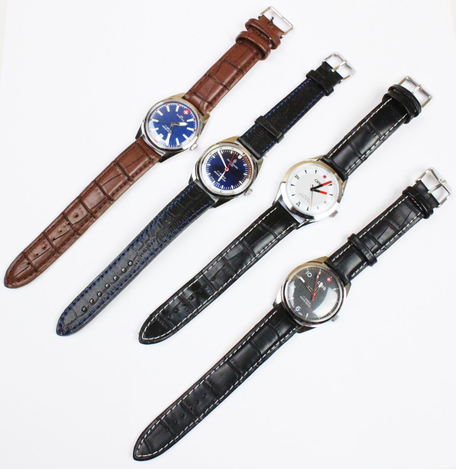 A selection of four gentleman's stainless steel 17 jewel shockproof wristwatches, including two