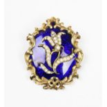 A Victorian enamel and seed pearl set memorial brooch, the central floral motif set with seed pearls