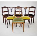 A set of three late 19th century French walnut dining chairs, each with a twin rail back,raised upon