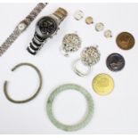 An assortment of lady's and gentlemen's costume jewellery, to include a carved jade coloured bangle,