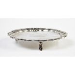 A George II silver waiter, London 1744, with piecrust and shell rim, of plain polished form with