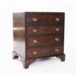 A George III style mahogany chest of four drawers, 20th century, with four graduated cock beaded