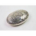 A 19th century Dutch silver snuff box, of oval form, the cover decorated with embossed figures on