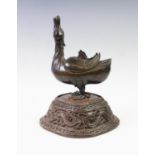 A Chinese bronze incense burner in the form of a goose, 18th/19th century, the goose modelled in the