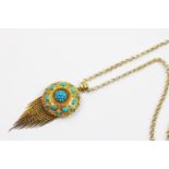 A Victorian Etruscan revival turquoise set fringe pendant, the circular yellow metal pendant with