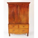 A Victorian mahogany linen press, formed of two panelled doors enclosing four press trays above