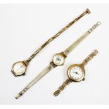 A lady's 9ct gold wristwatch, the white enamel dial with Arabic numerals, round plain polished 9ct